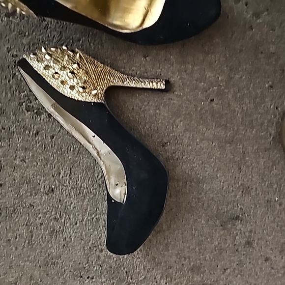Practically new black swayed heels with gold steads and spikes on the back. - Picture 3 of 3